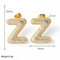 FLOLA Clear Crystal Bubble Letter Earrings for Women Copper Gold Plated Initial Ear Studs Name Jewelry Gifts ersa009