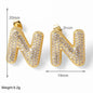 FLOLA Clear Crystal Bubble Letter Earrings for Women Copper Gold Plated Initial Ear Studs Name Jewelry Gifts ersa009