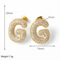 FLOLA Clear Crystal Bubble Letter Earrings for Women Copper Gold Plated Initial Ear Studs Name Jewelry Gifts ersa009