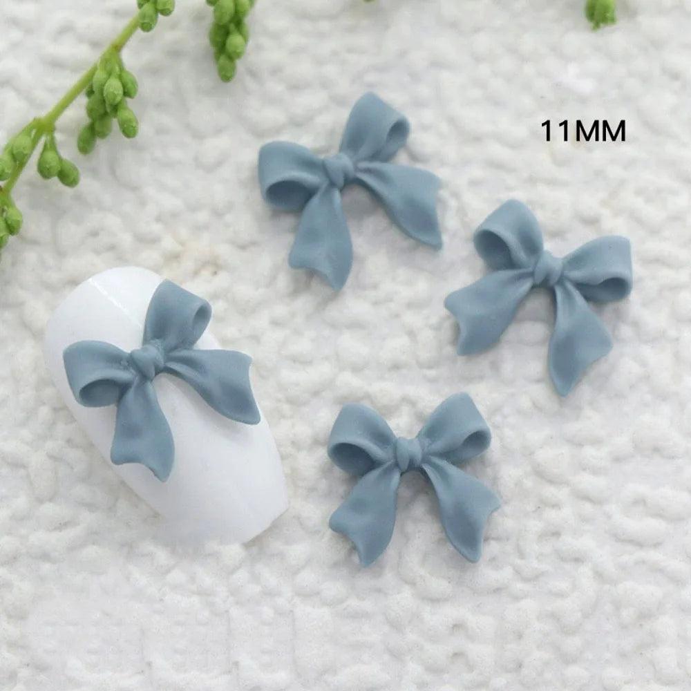 50/100Pcs Aurora Ribbon Bowknot Nail Art Charms Summer Kawaii Fairy Resin Bow Nail Art Decoration Flatback Bowtie Manicure Parts