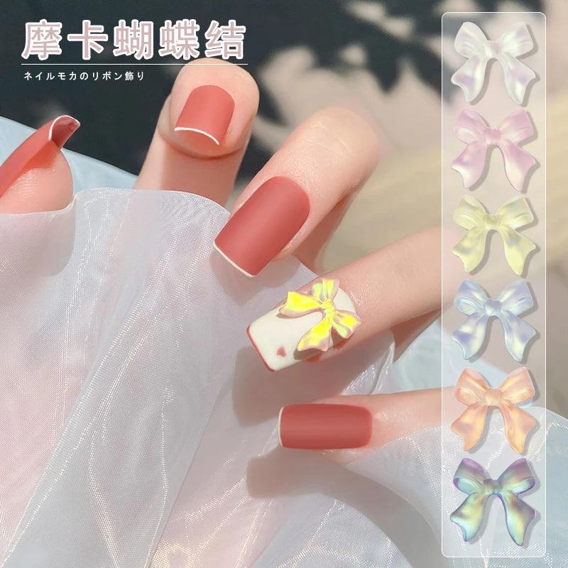 50/100Pcs Aurora Ribbon Bowknot Nail Art Charms Summer Kawaii Fairy Resin Bow Nail Art Decoration Flatback Bowtie Manicure Parts